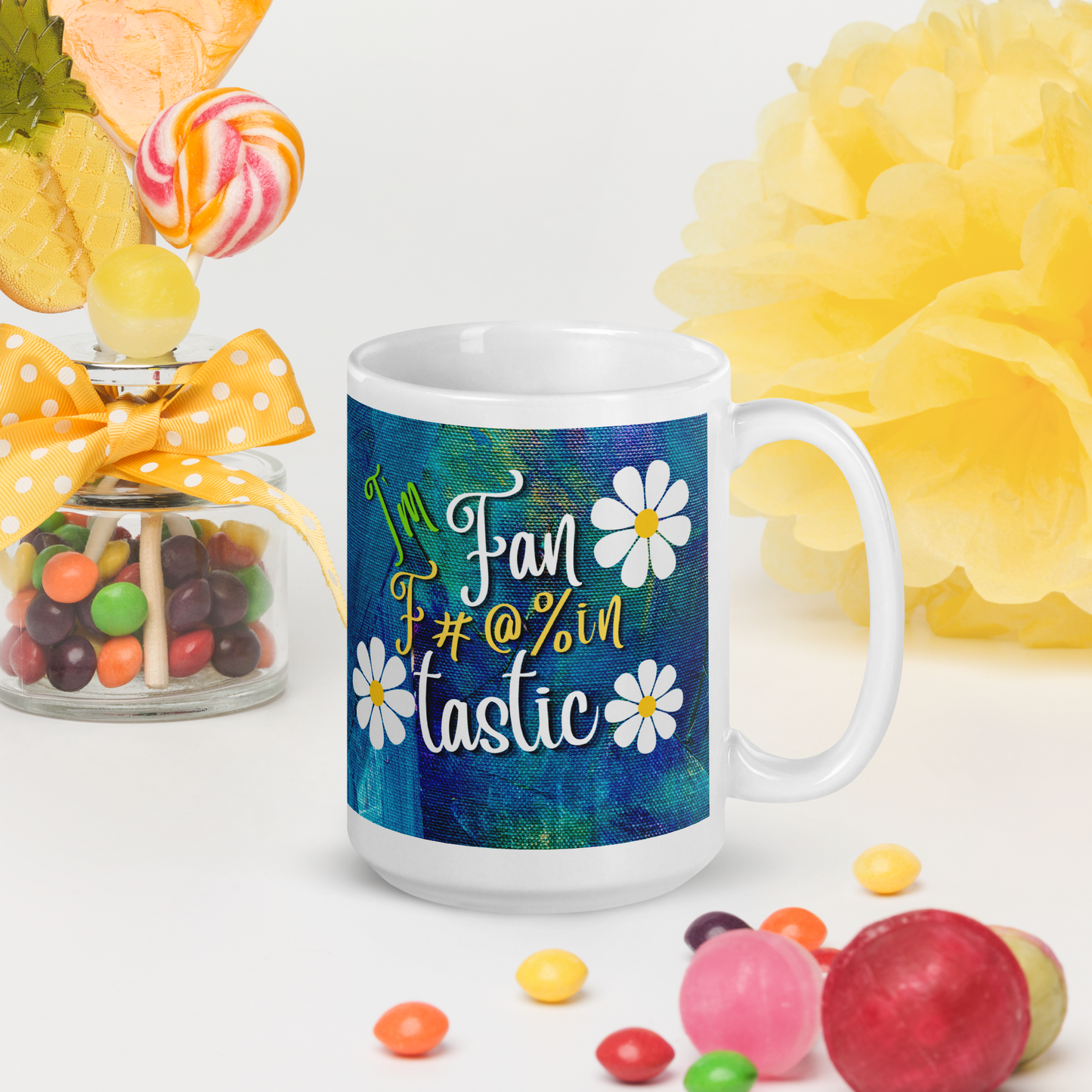 White glossy mug with blue and green textured background with the words I'm fan F#@% in Tastic. made for right or left handed people.