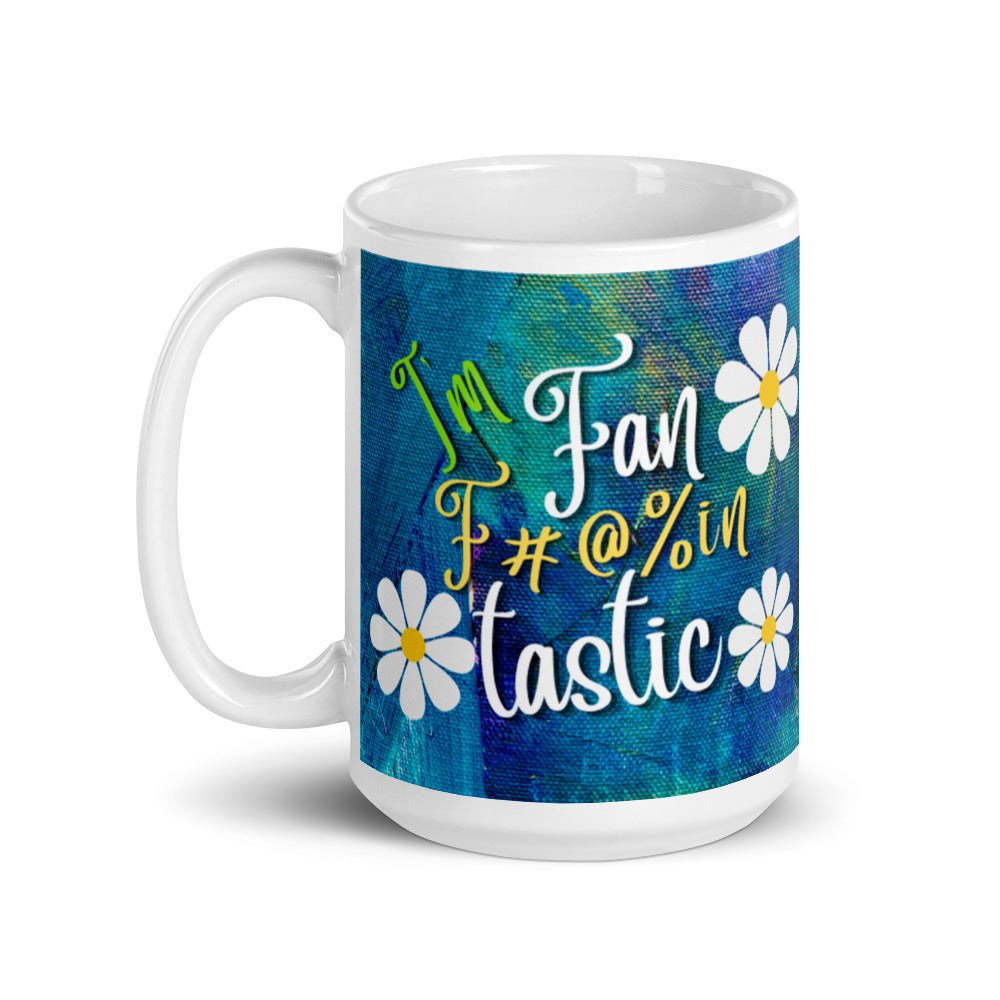 White glossy mug with blue and green textured background with the words I'm fan F#@% in Tastic. made for right or left handed people.