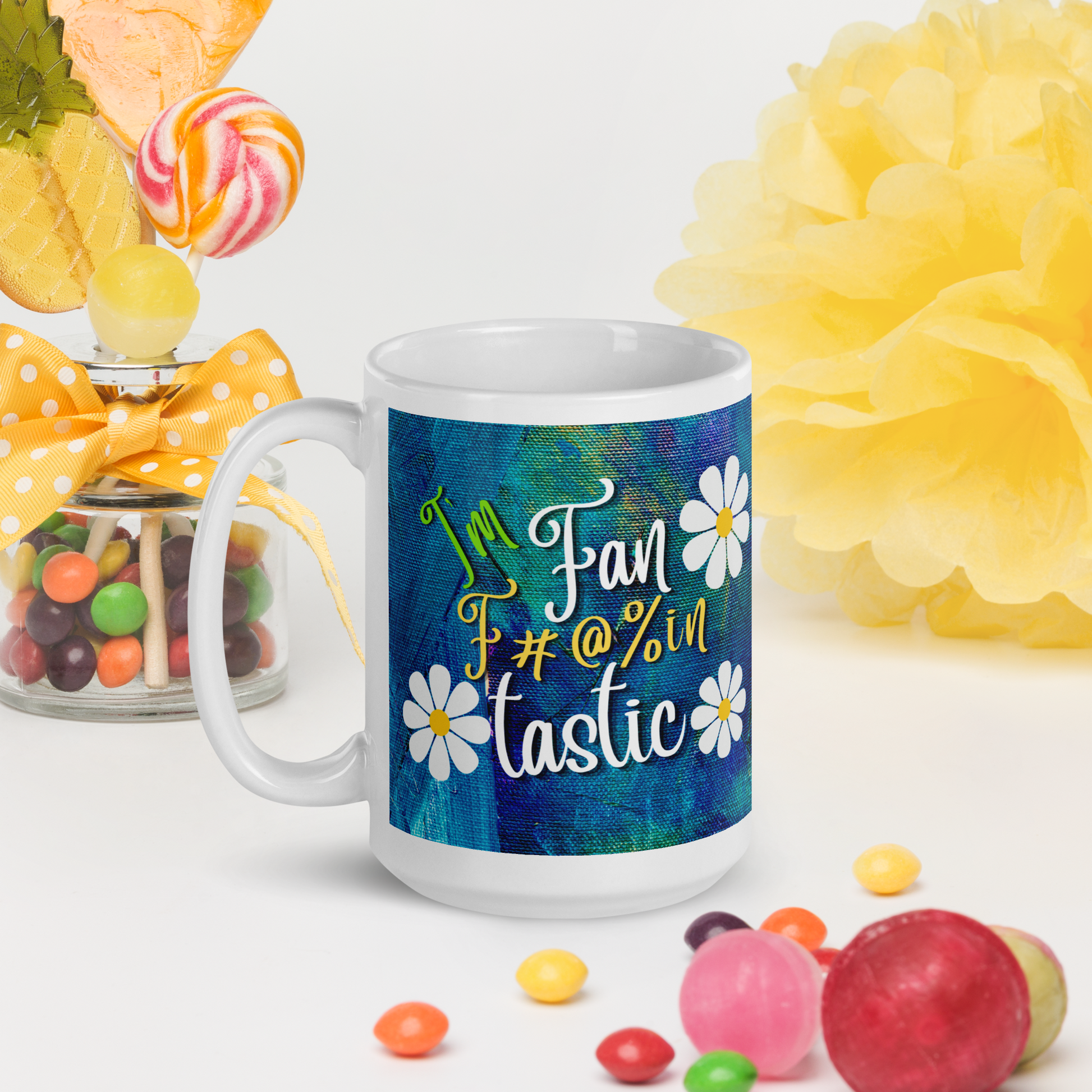 White glossy mug with blue and green textured background with the words I'm fan F#@% in Tastic. made for right or left handed people.